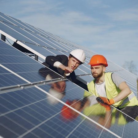 foreman-and-businessman-at-solar-energy-station-YDYDKWR.jpg